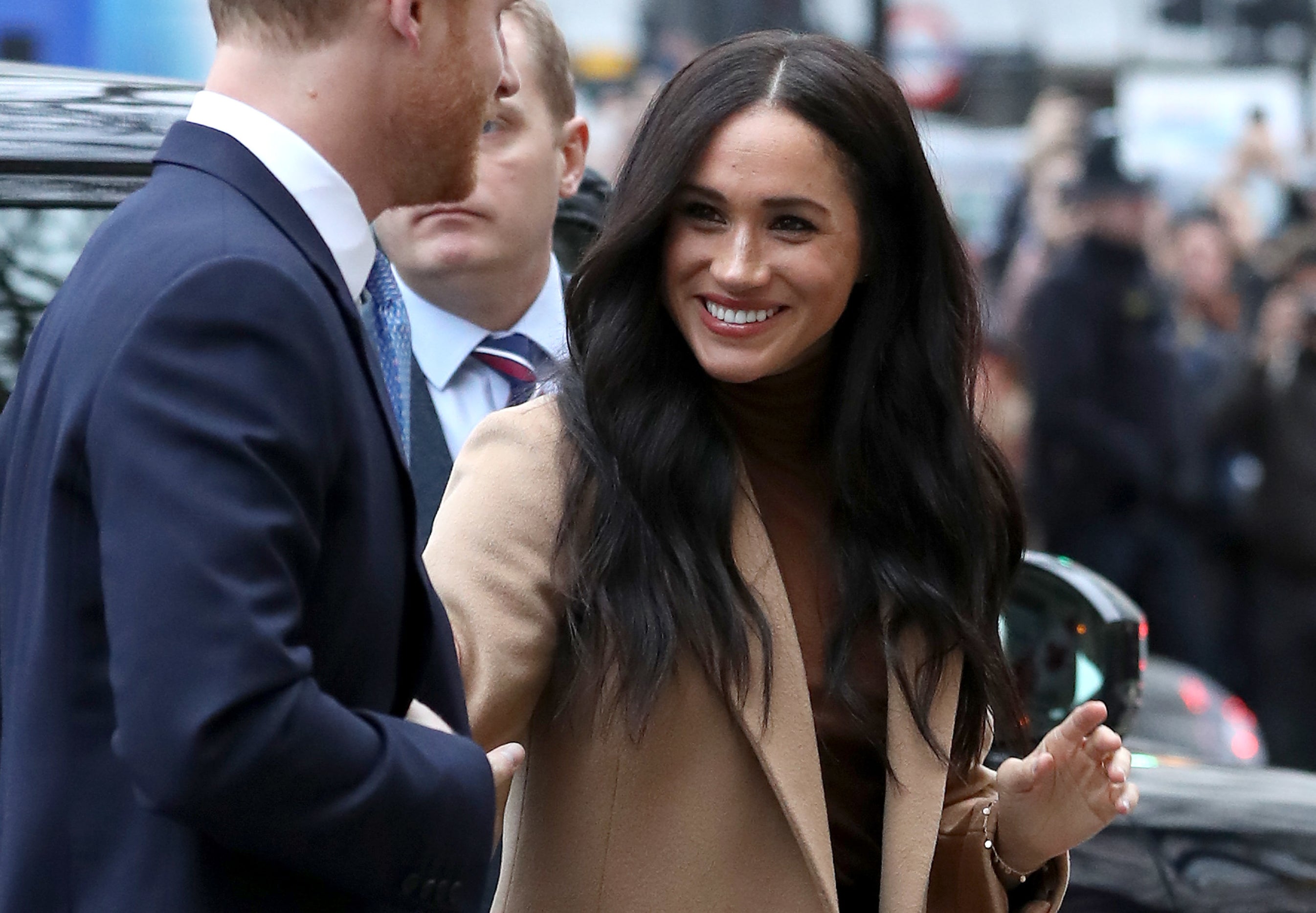 Meghan smiles on her way to an event