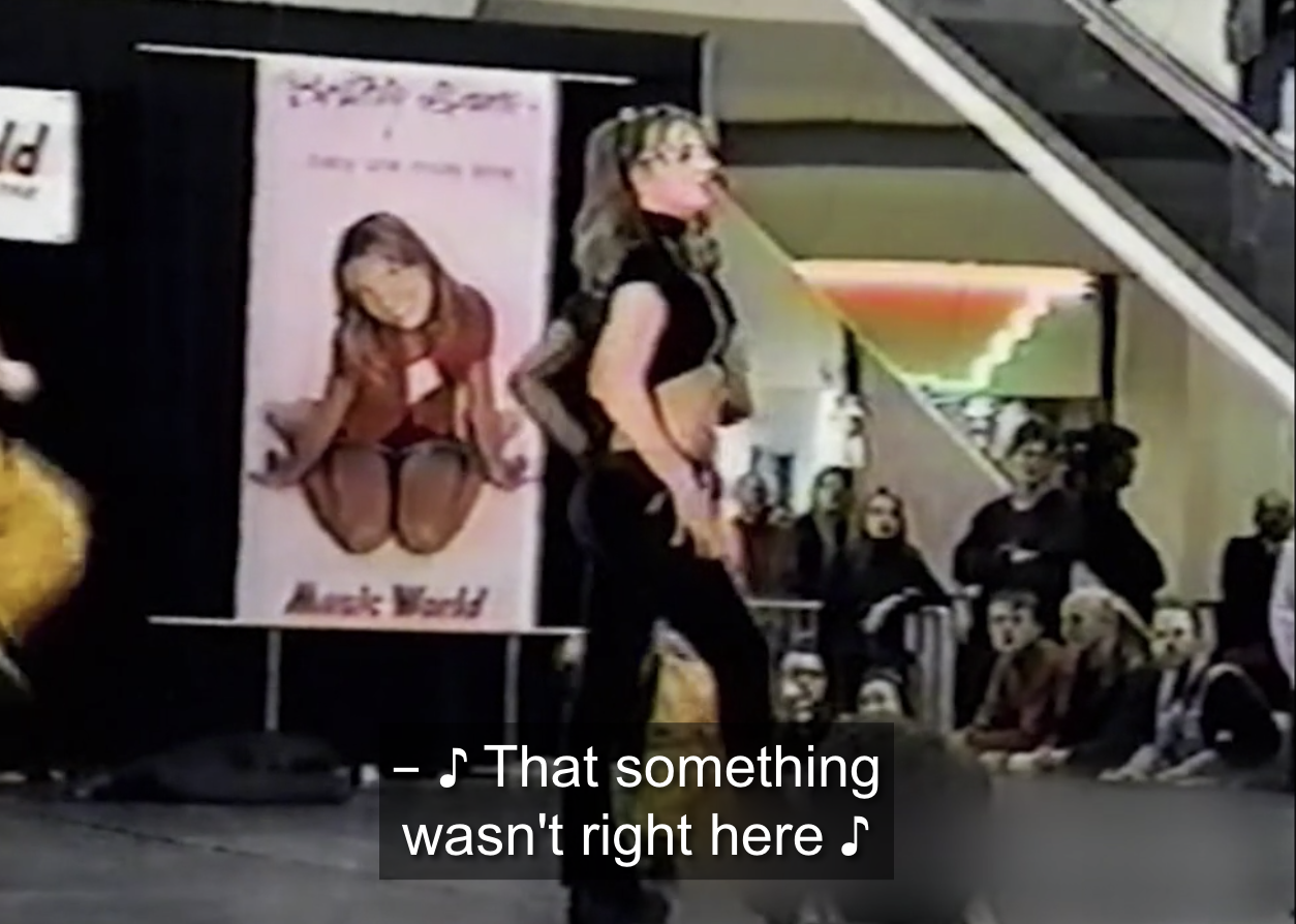 Archived footage of Britney Spears performing &quot;...Baby One More Time&quot; in a mall
