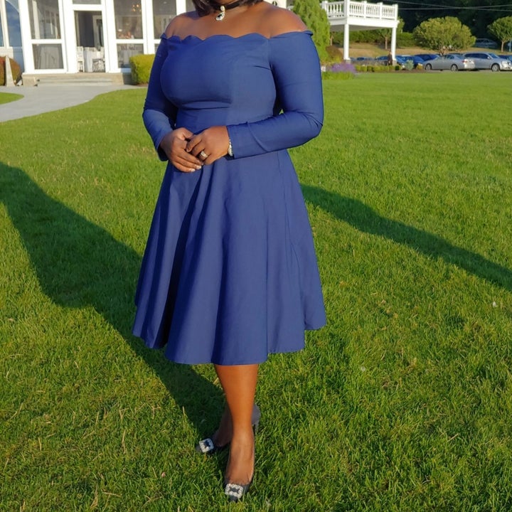 customer review photo of them wearing the dress in blue 