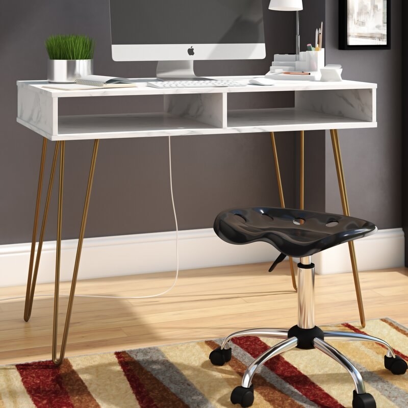 the marble desk with gold legs 
