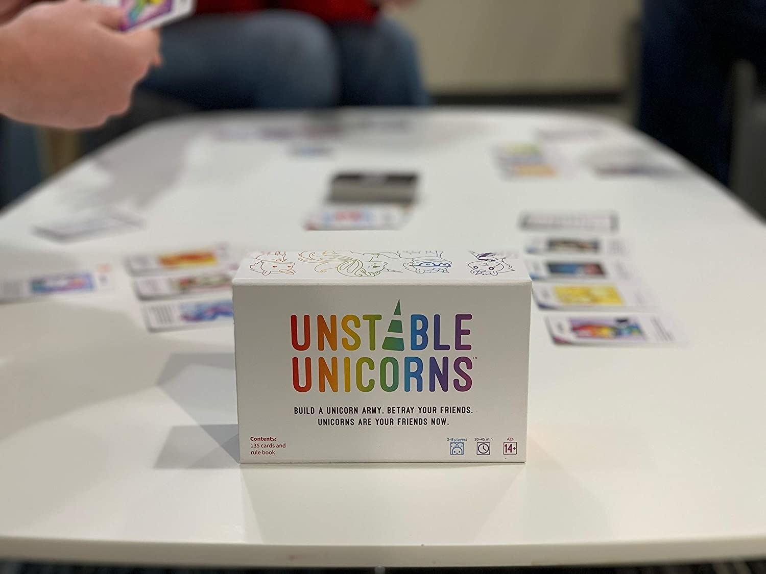 The box of Unstable Unicorns on a table 