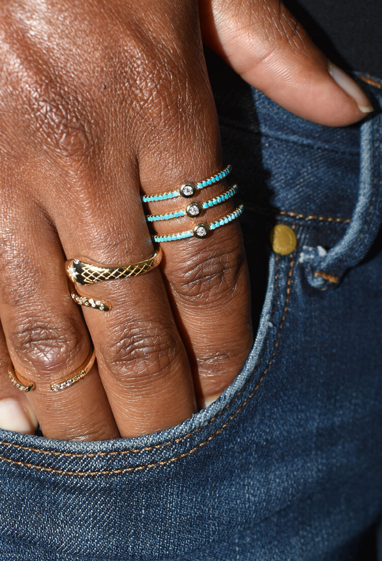 Model wearing the turquoise and cubic zirconia ring