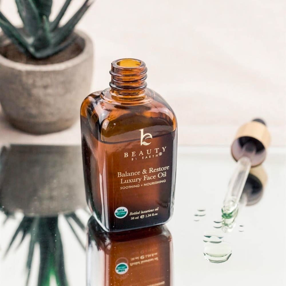 The bottle of the Balance &amp;amp; Restore Luxury Face Oil