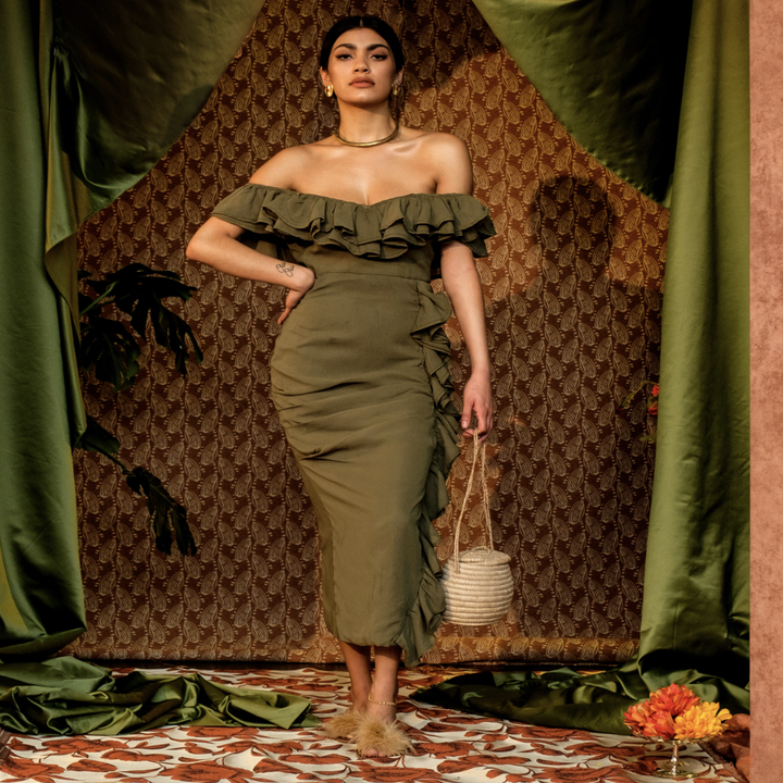 model wearing olive green off shoulder dress