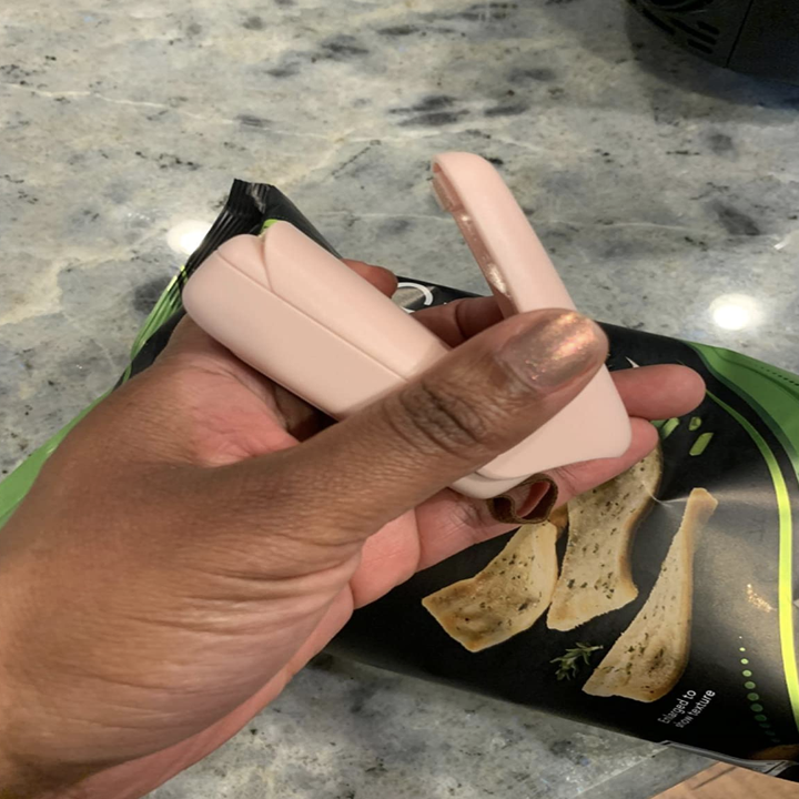 reviewer holding up pink sealer