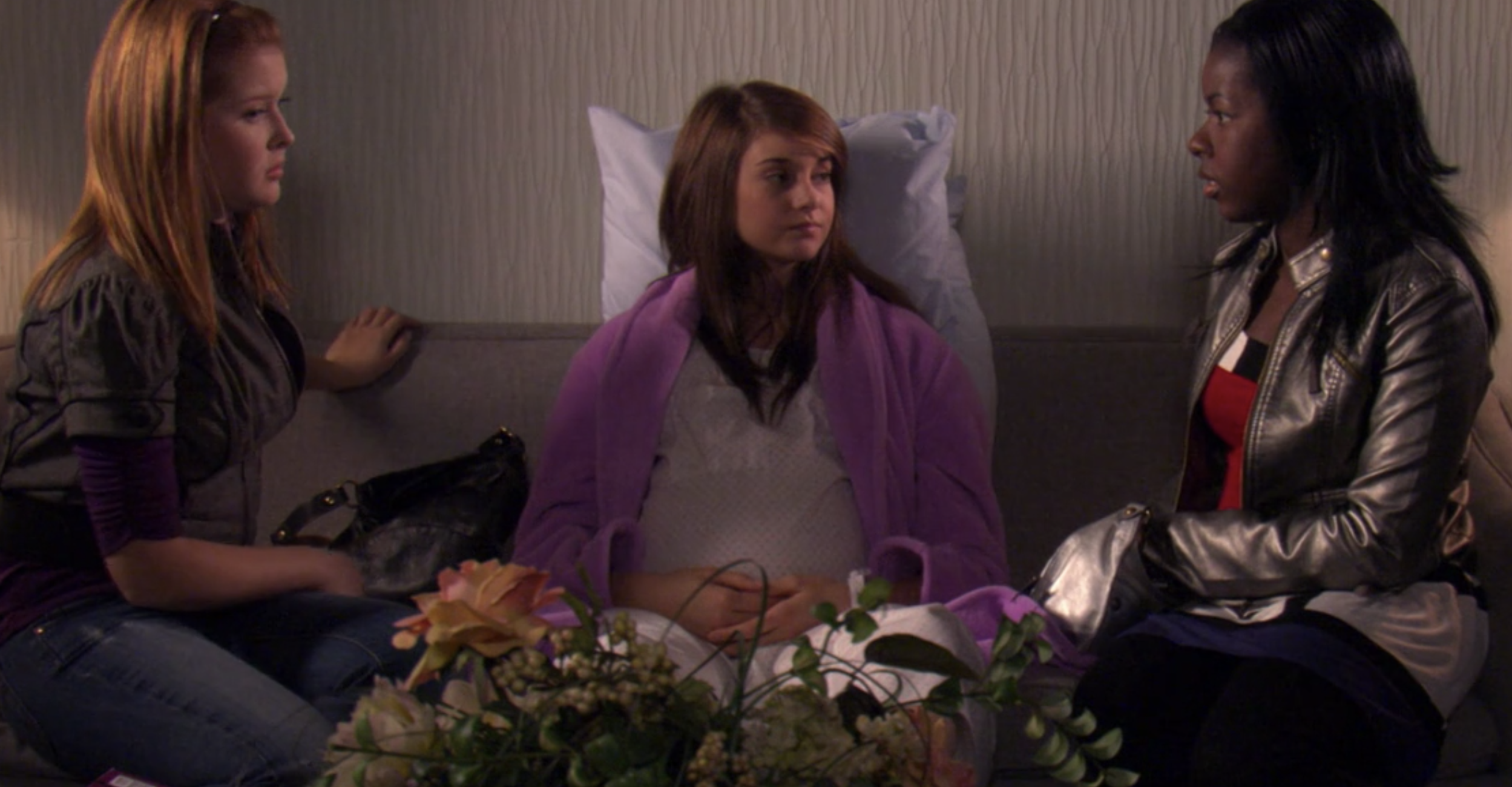 Amy from &quot;The Secret Life of the American Teenager&quot; nine months pregnant sitting on a couch in the hospital