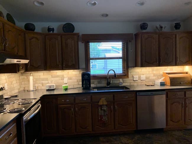 reviewer image of under cabinet LED lights turned on in a customer's kitchen