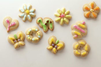 Several cookies in different shapes with multi-colored frosting decorations 
