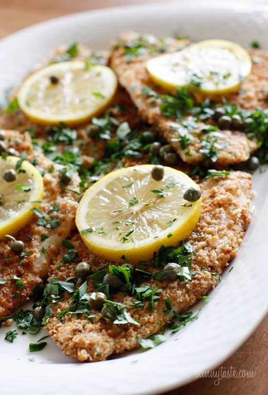 Four pieces of breaded flounder piccata with capers, herbs, and lemon.
