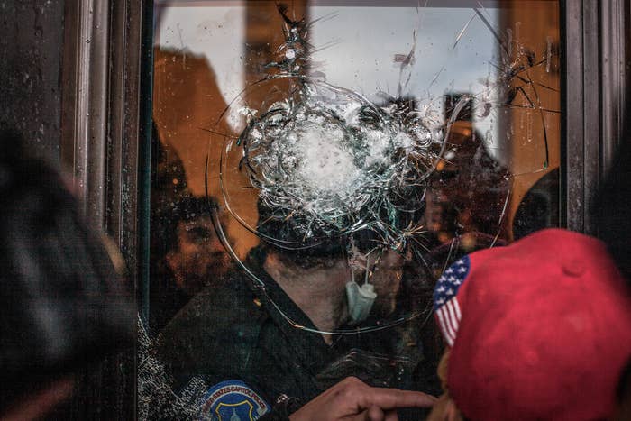 A broken window at the US Capitol during the insurrection