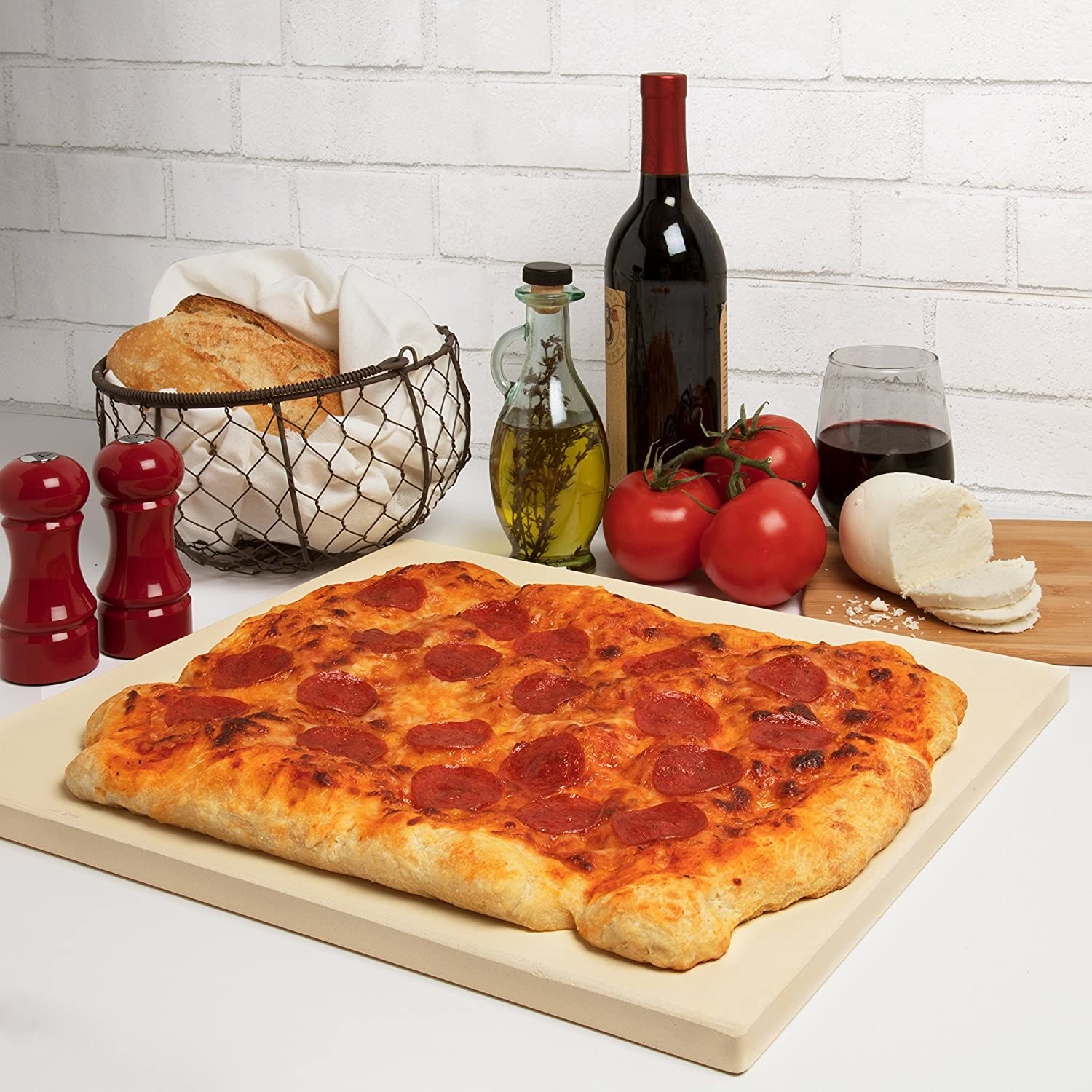 Large rectangular pizza on thick pizza stone 