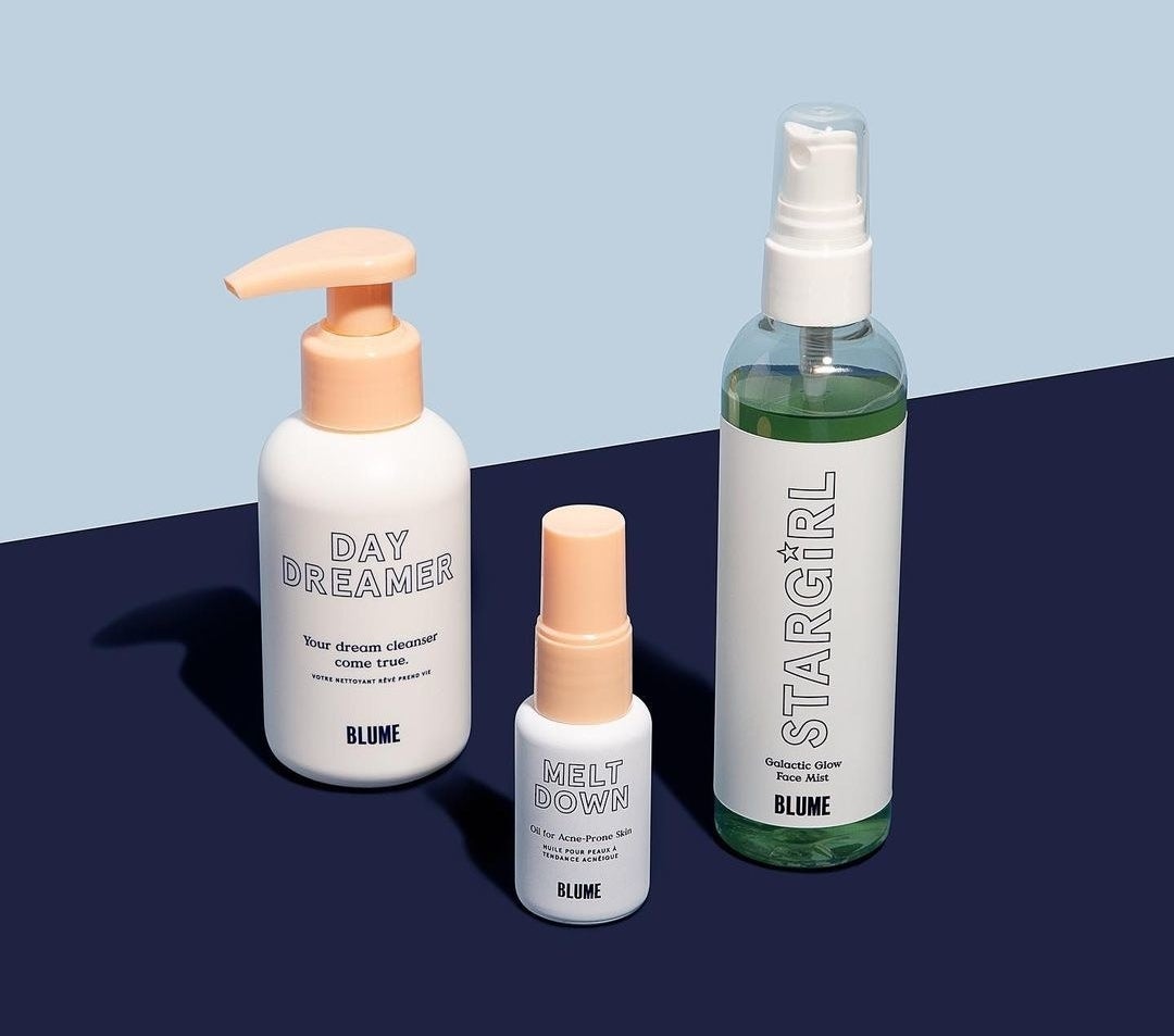 A trio kit containing the cleanser, acne oil, and face mist on a graphic background