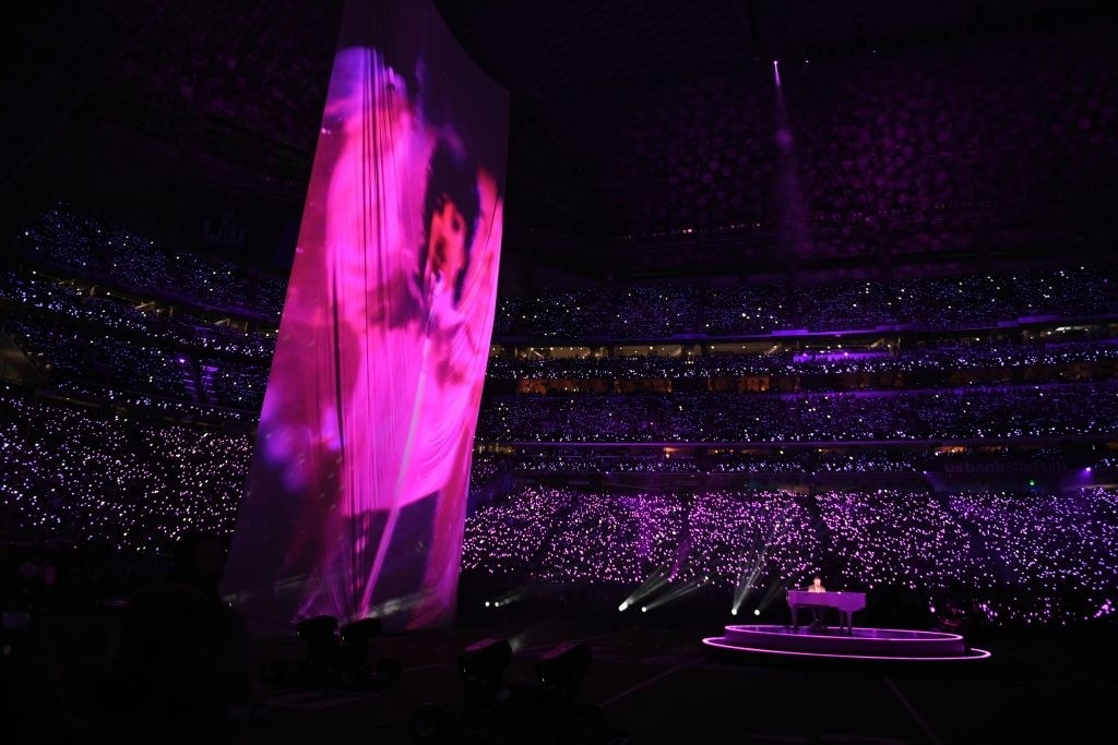 Prince is projected on a large screen as Justin Timberlake performs on stage during the Super Bowl LII halftime show