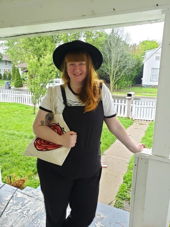 reviewer image of a plus-size customer wearing the black Aedvoouer Women's Jumpsuit on a front porch