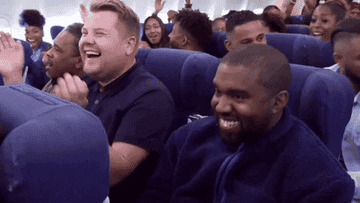 People sit next to each other on an airplane