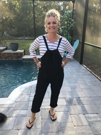 reviewer image of a customer wearing the black Aedvoouer Women's Jumpsuit near a backyard pool
