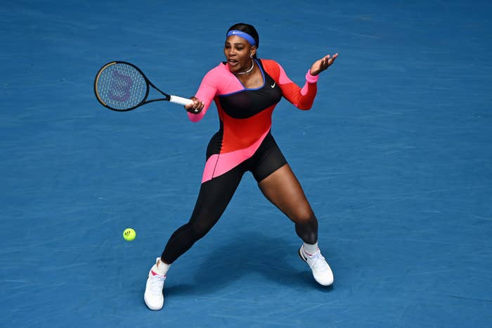 Serena Williams wears a one-legged catsuit on the tennis court. 