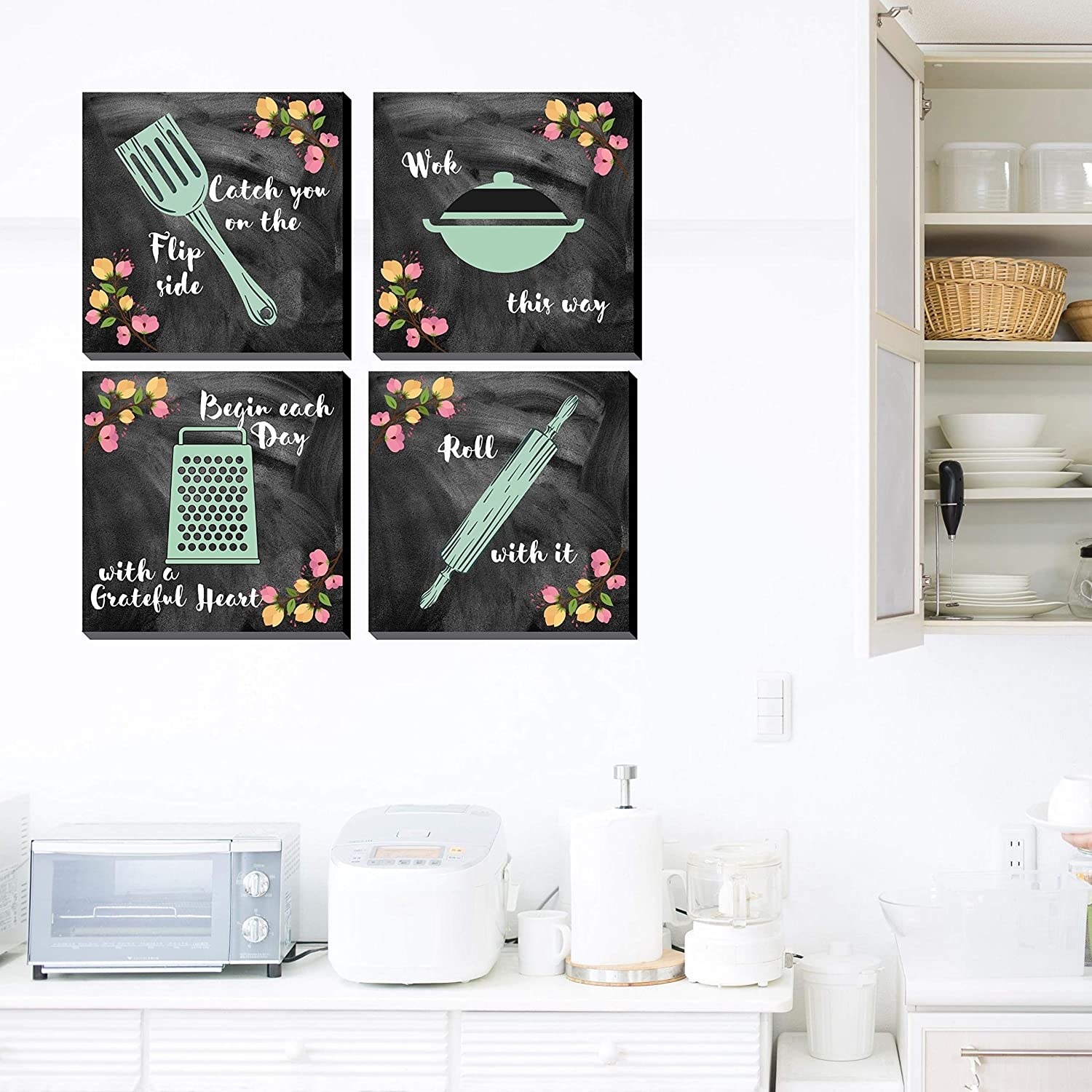 A set of chalkboard paintings on the wall in the kitchen.