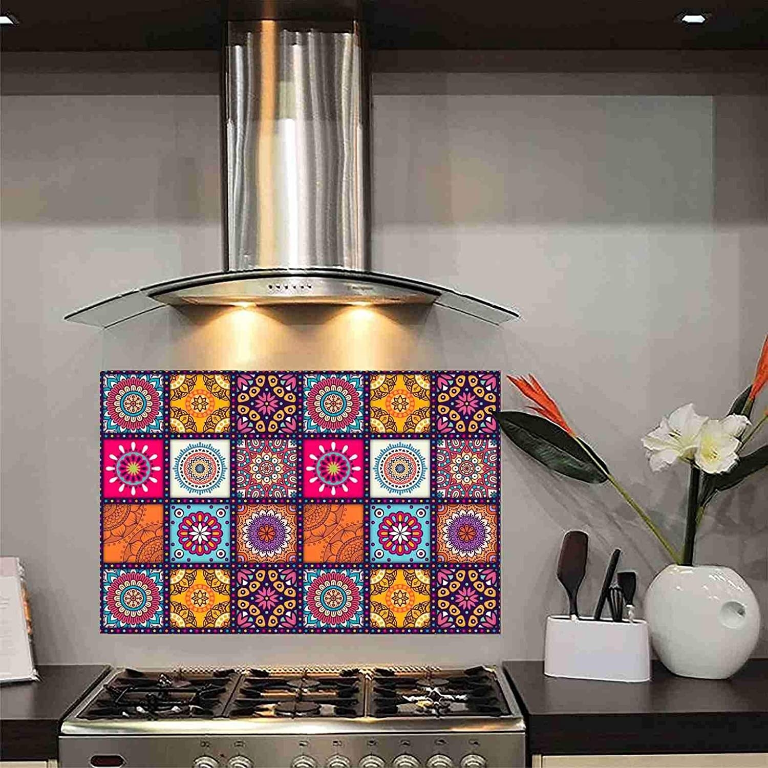 Colourful kitchen tiles on a wall on top of a stove 