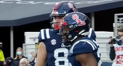 Blue helmet with the words &quot;Ole Miss&quot; written in cursive and red