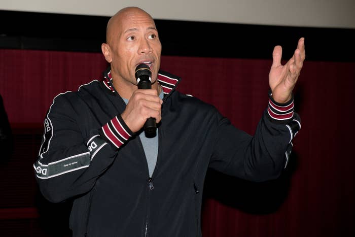 Dwayne speaking into a microphone