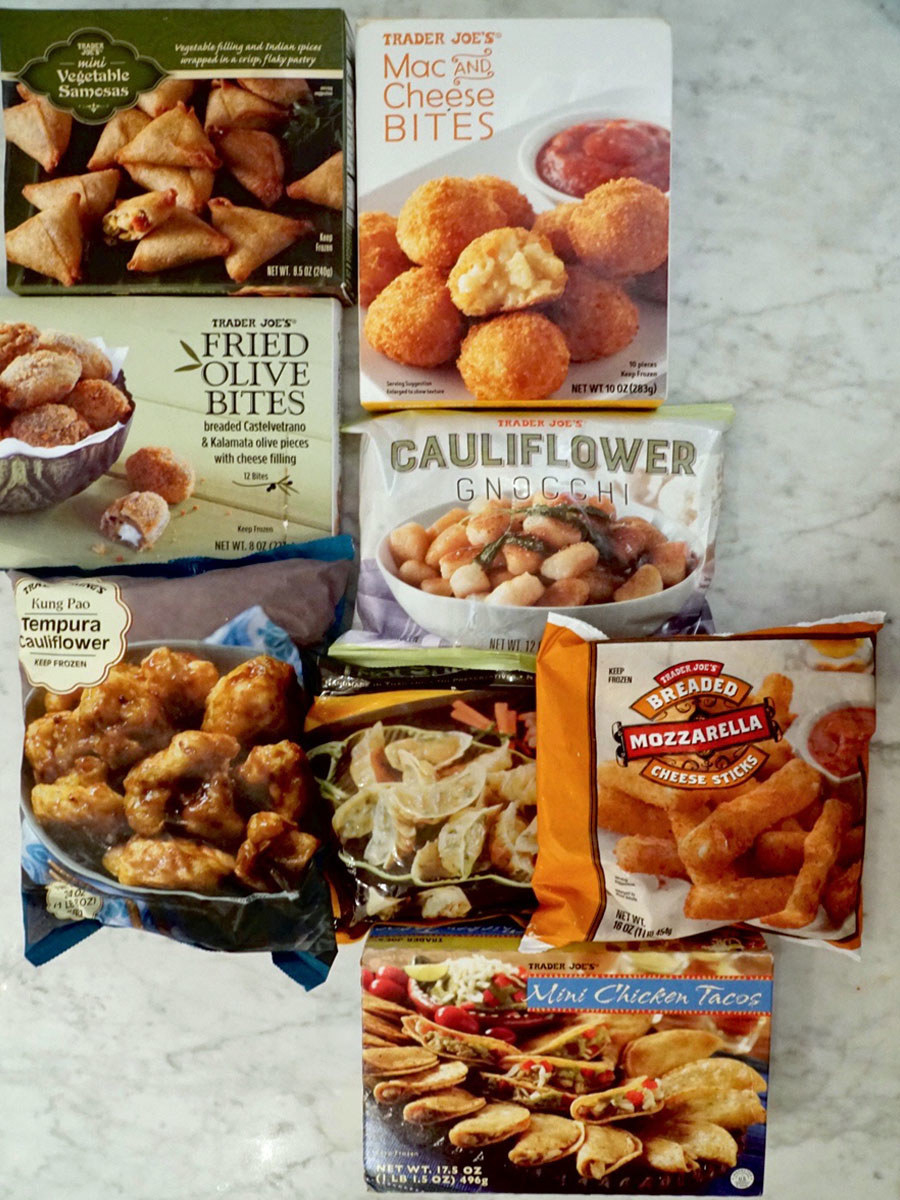 A bunch of Trader Joe&#x27;s frozen products on a countertop.