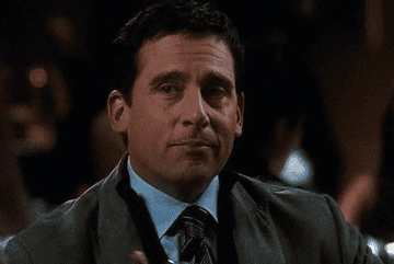 Gif of Michael Scott from The Office winking and raising a glass