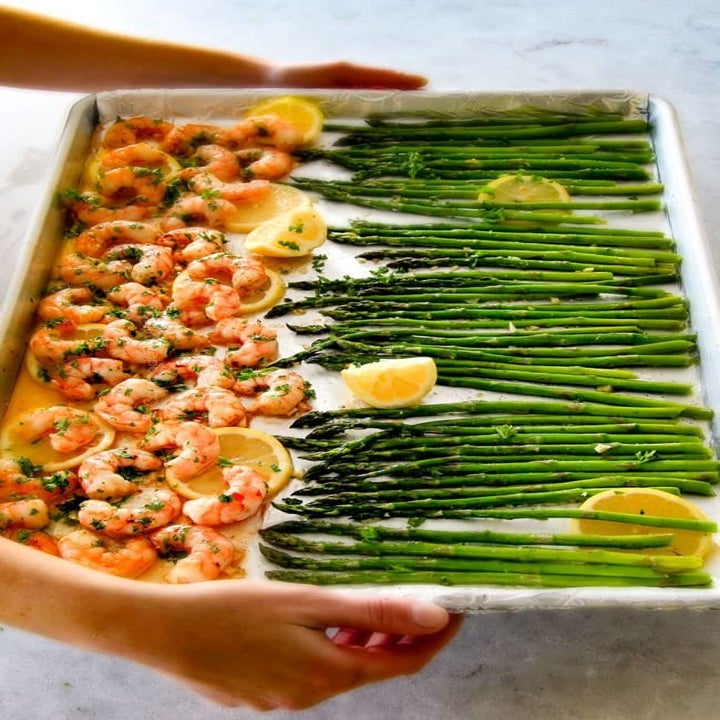 Sheet pan shrimp and asparagus with lemon.