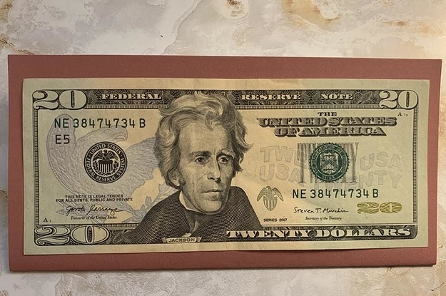 20 dollar bill on top of a budget envelope