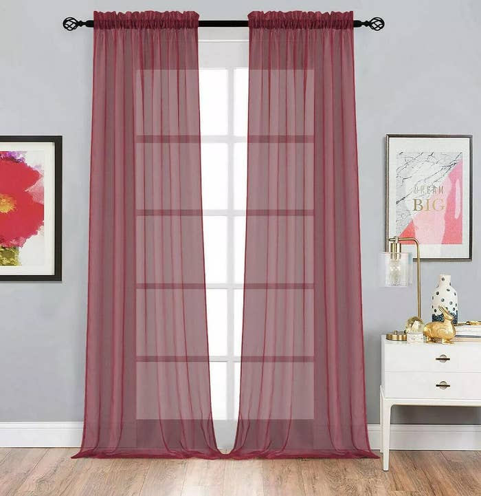 The burgundy curtains
