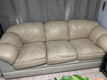 reviewers old leather couch before adding covers
