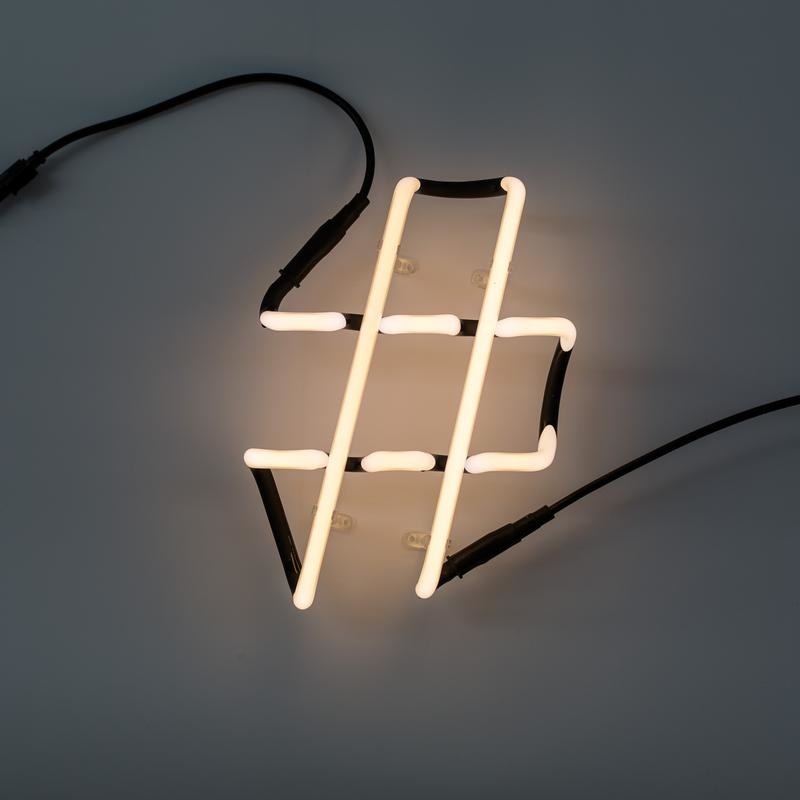 the seletti number sign neon lamp on a wall