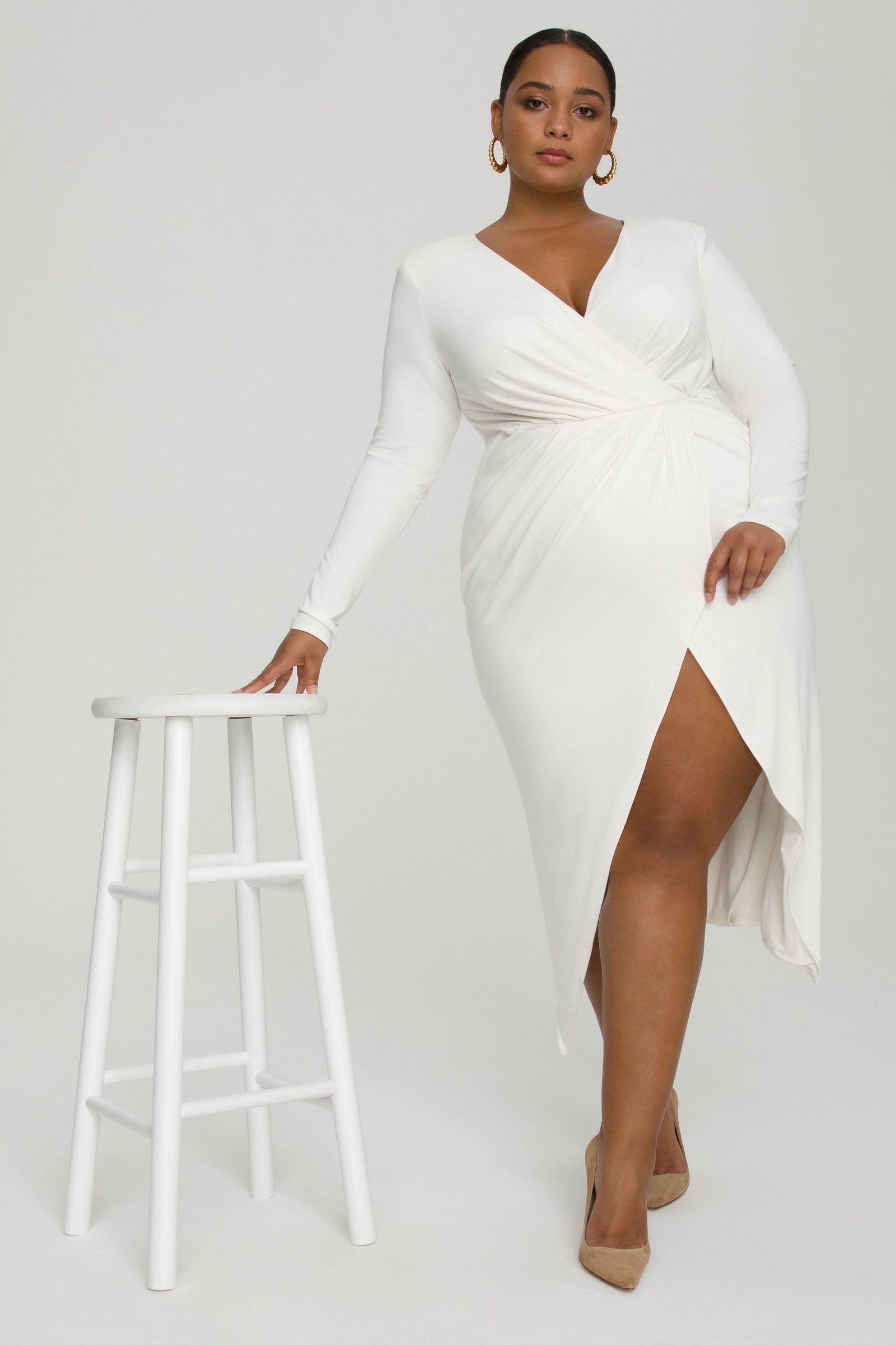 model wearing the white wrap dress