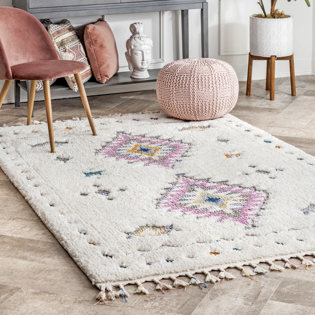 the cloudcraft carved tribal shag area rug in a living room