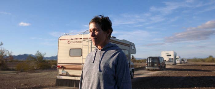 Frances McDormand as Fern in Nomadland, watching RV drive by 