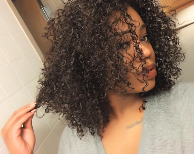 reviewer curls looking hydrated and healthy after using formula