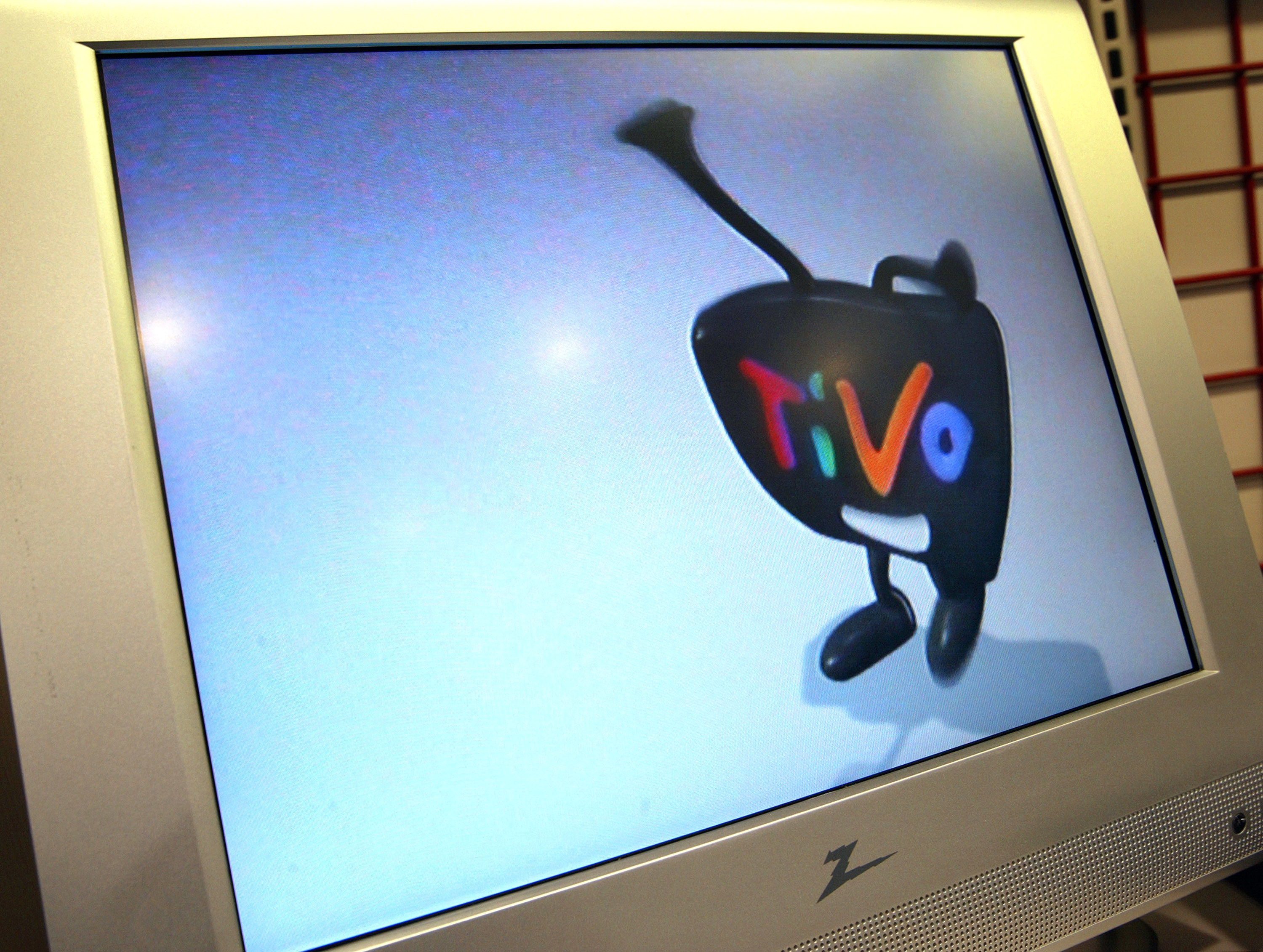 A TiVo logo is seen on a monitor at a Best Buy store