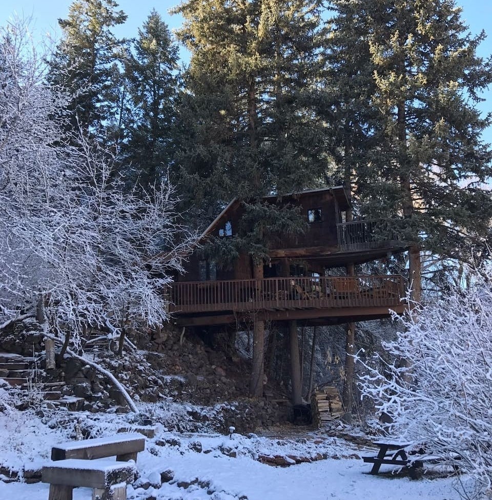 the wooden cabin in a snowy mountain