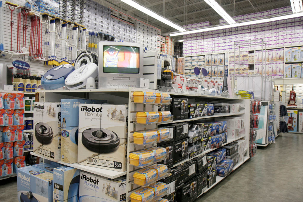 Merchandise display inside Bed Bath and Beyond with a TV on the top of it