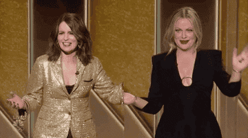 Amy and Tina wave during the Golden Globes