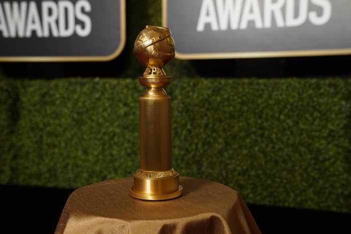 A Golden Globes award on top of a table