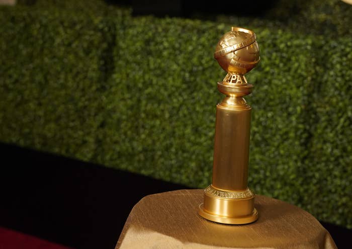 A Golden Globes trophy atop a table
