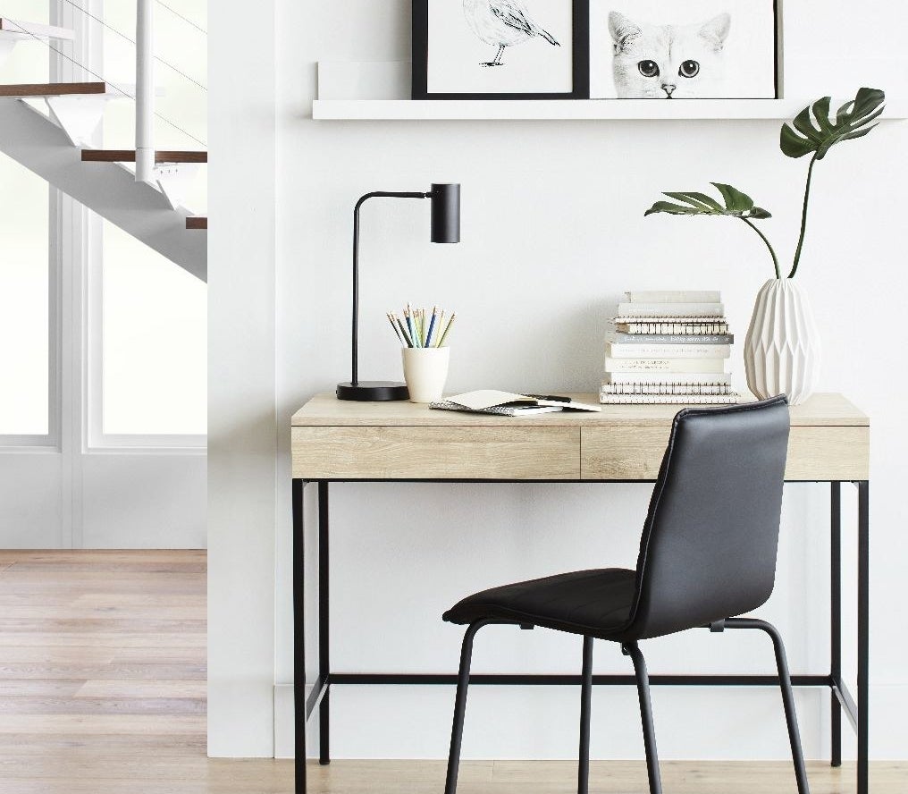 Wooden desk with black metal legs 
