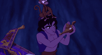 Aladdin rubbing the magic genie lamp