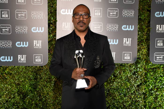 Eddie Murphy holding a trophy at the Critics' Choice Awards in Santa Monica in 2020