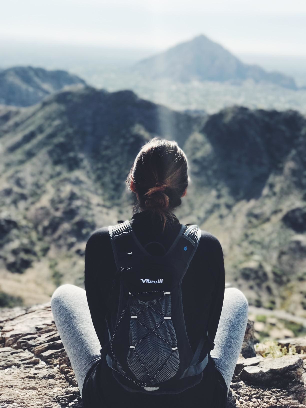 A woman wearing the hydration backpack