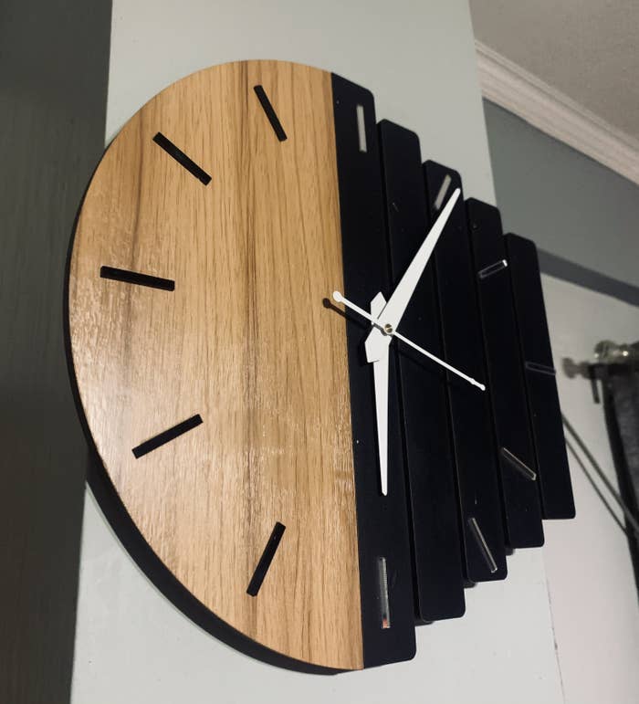 Wall clock hung on the wall.