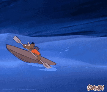 Scooby Doo frantically paddling a boat