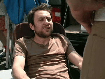 gif of charlie from it&#x27;s always sunny in philadelphia making a suspicious face of realization