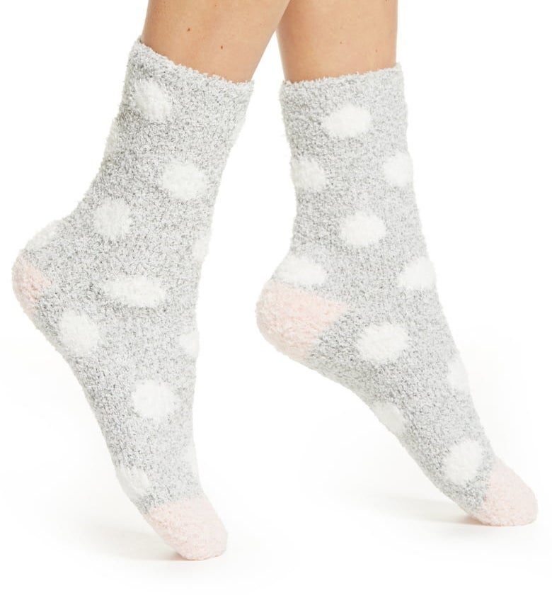 A model wears the socks in Gray Sleet Marl Dot